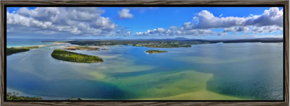 Across the Inlet as a panoramic canvas in a walnut floating frame